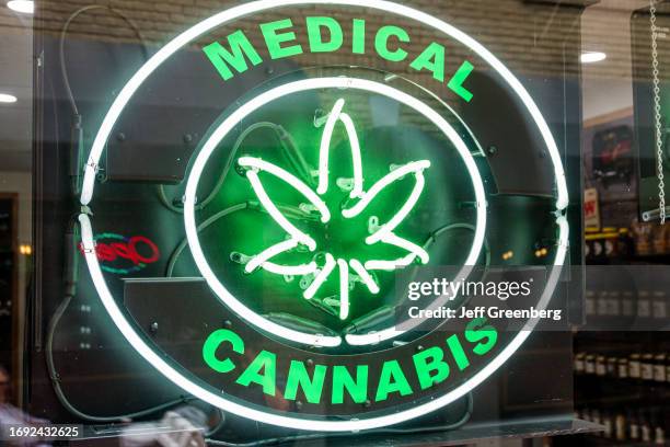 Charlotte North Carolina, neon sign advertising medical use cannabis, marijuana leaf.