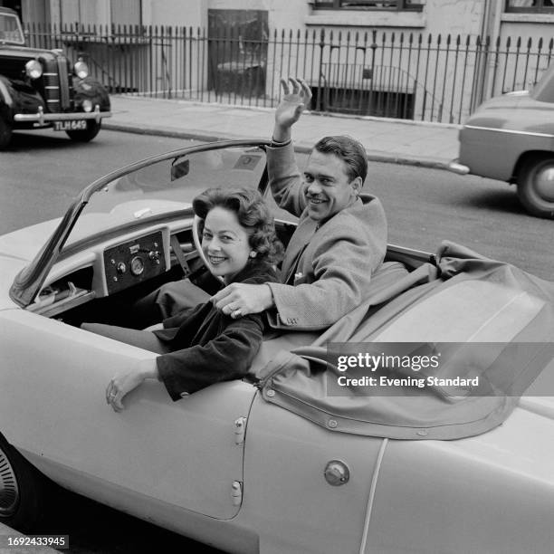 Danish tennis player Kurt Nielsen with his wife Helle, in a convertible car, London, July 1958. Nielsen was competing in the men's semi-final of the...