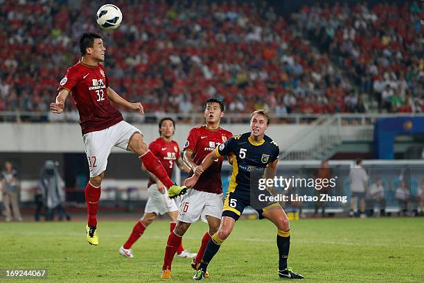 Sun Xiang of Guangzhou Evergrande heads the ball during the AFC Champions League knockout round match between Guangzhou Evergrande and Central Coast...