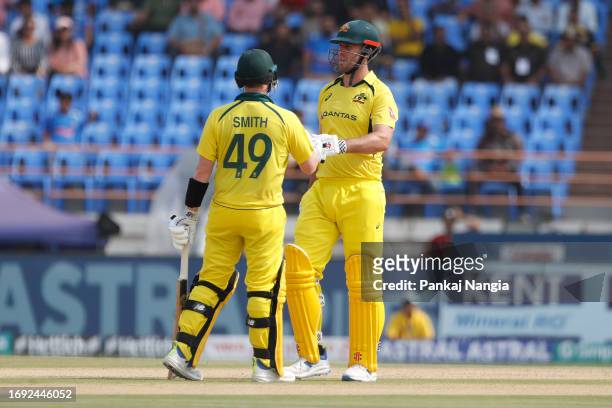 Mitchell Marsh and Steven Smith of Australia interact during game three of the One Day International series between India and Australia at Saurashtra...