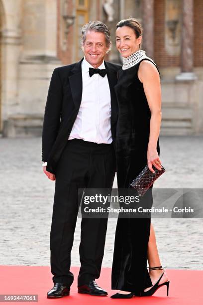 Hugh Grant and Anna Elisabet Eberstein arrive at the Palace of Versailles ahead of the State Dinner held in honor of King Charles III and Queen...