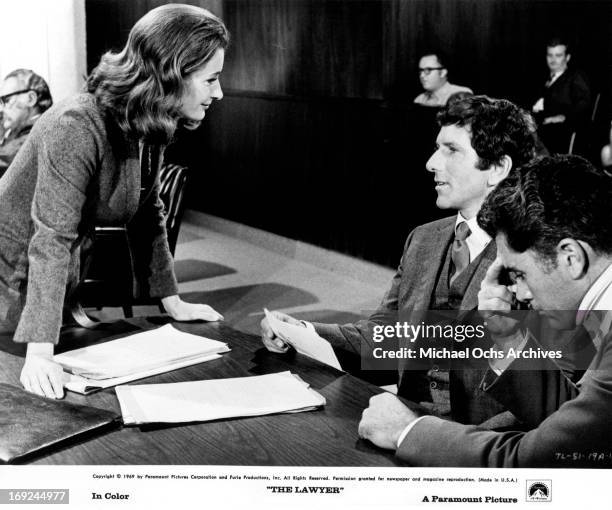 Diana Muldaur approaches Barry Newman and Robert Colbert in a scene from the film 'The Lawyer', 1970.