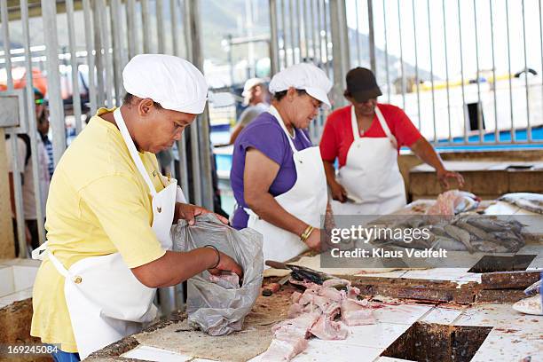 Woman Packing Fish In Bag At Fish Market High-Res Stock Photo