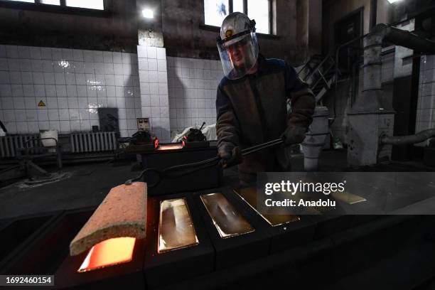 Worker casts ingots of 99.99 percent pure gold at Novosibirsk Refining Plant, Russia's leading gold refining and bar manufacturing plant, in...