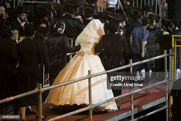 Ultra-Orthodox Jewish women walk with Hannah Batya Penet, the bride of Shalom Rokeach, grandson of the Chief Rabbi of Belz, during a wedding ceremony...