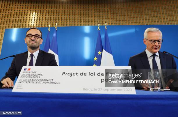 French Minister for the Economy and Finances Bruno Le Maire speaks nexto to French Junior Minister for Public Accounts Thomas Cazenave during a press...