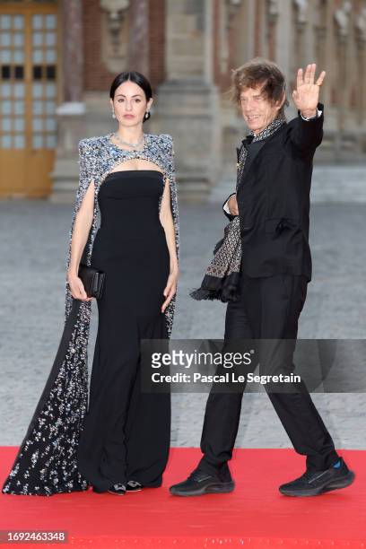 Melanie Hamrick and Mick Jagger arrive at the Palace of Versailles ahead of the State Dinner held in honor of King Charles III and Queen Camilla in...