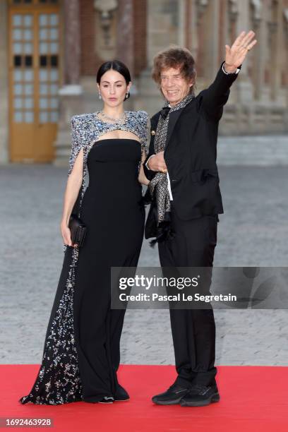 Melanie Hamrick and Mick Jagger arrive at the Palace of Versailles ahead of the State Dinner held in honor of King Charles III and Queen Camilla in...