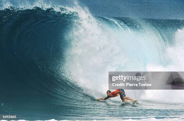 Kelly Slater of the USA drops into a wave on his way to third place in the Xbox Pipeline Masters at the Banzai Pipeline on the North Shore of Oahu,...