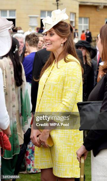 Catherine, Duchess of Cambridge attends a Garden Party in the grounds of Buckingham Palace hosted by Queen Elizabeth II on May 22, 2013.