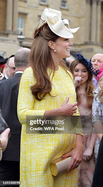 Catherine, Duchess of Cambridge attends a Garden Party in the grounds of Buckingham Palace hosted by Queen Elizabeth II on May 22, 2013.