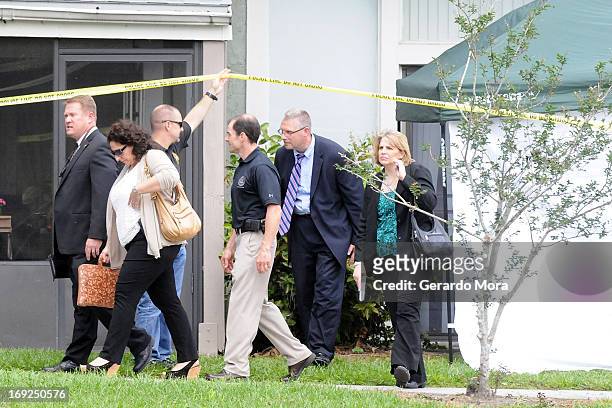 Federal Bureau of Investigation agents leave the apartment complex where a suspected friend of the Boston bombers was shot and killed by FBI on May...