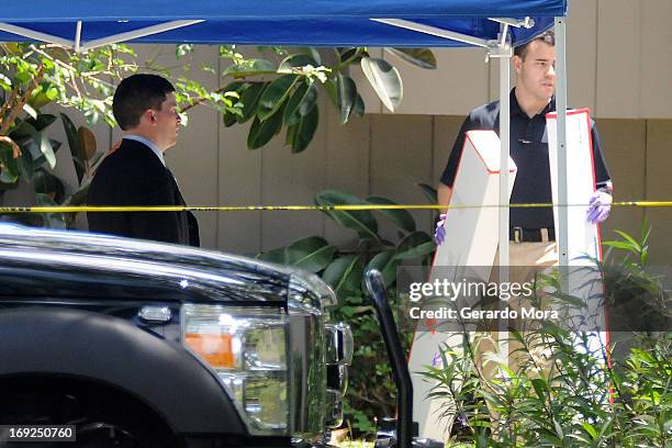 Federal Bureau of Investigation evidence response team takes out evidence from an apartment where a suspected friend of the Boston bombers was shot...