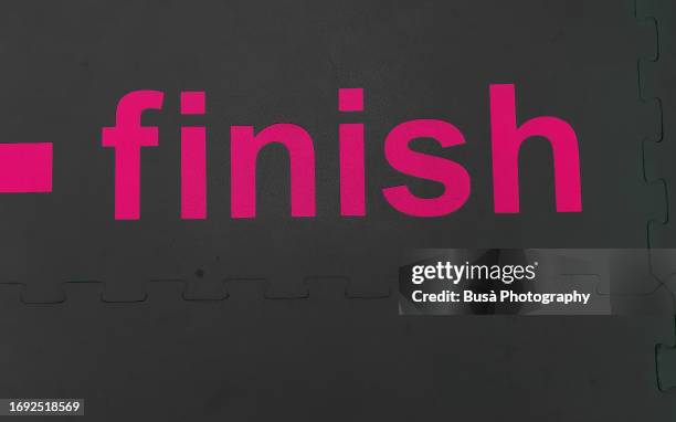 "finish" text on dark background - closing time stock pictures, royalty-free photos & images