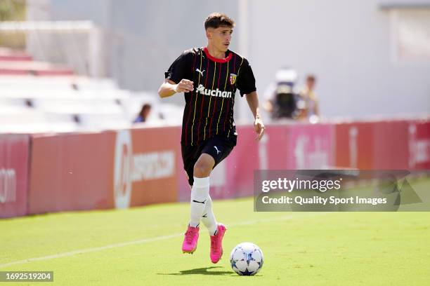 Matteo Escouflaire of RC Lens runs with the ball during the UEFA Youth League 2023/24 match between Sevilla FC and RC Lens at Ramon Cisneros Palacios...