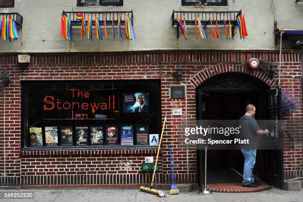 Man stands in the doorway of the historic gay bar The Stonewall Inn days after Mark Carson was killed after a man yelled homophobic slurs at him...