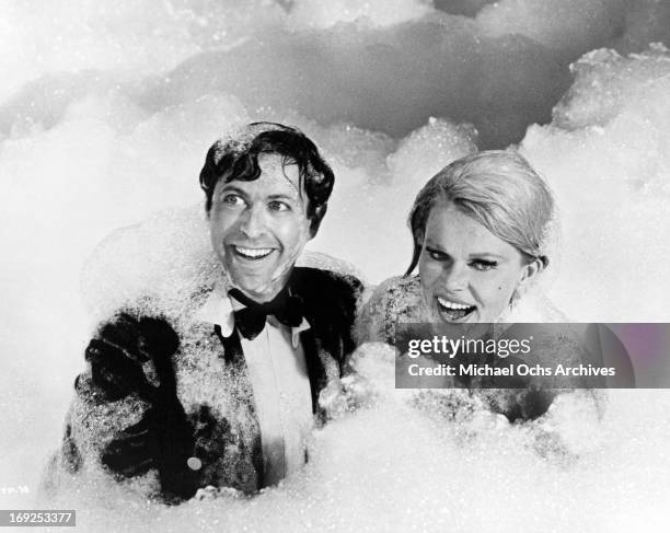 Steve Franken and Corinne Cole bury themselves in suds in a scene from the film 'The Party', 1968. (Photo by United Artists/Getty Images