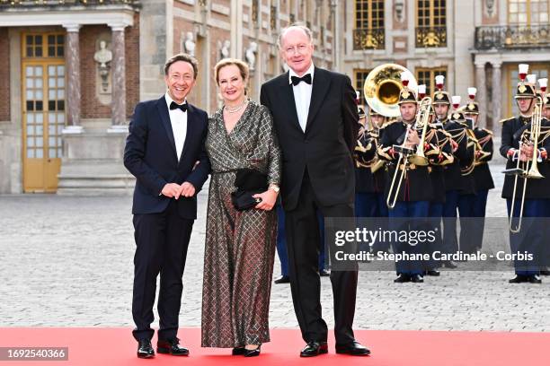 Stephane Bern, Laurence de Gaulle and Yves de Gaulle arrive at the Palace of Versailles ahead of the State Dinner held in honor of King Charles III...