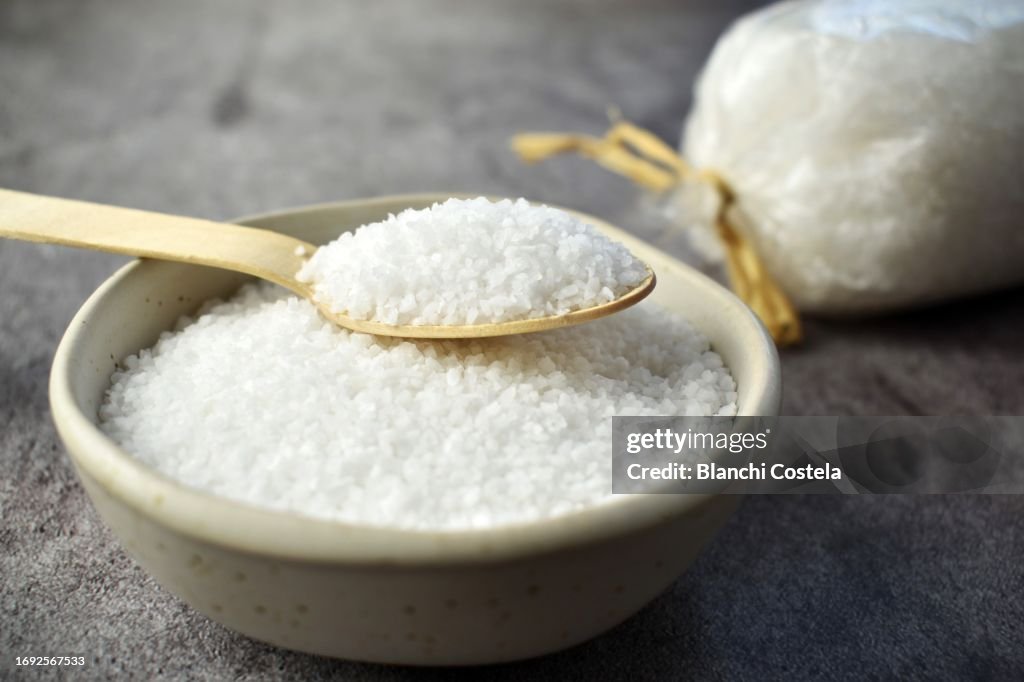 Thick salt on rustic background