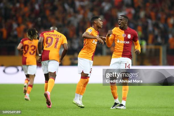 Wilfried Zaha of Galatasaray celebrates after Tete of Galatasaray scores their sides second goal during the UEFA Champions League match between...