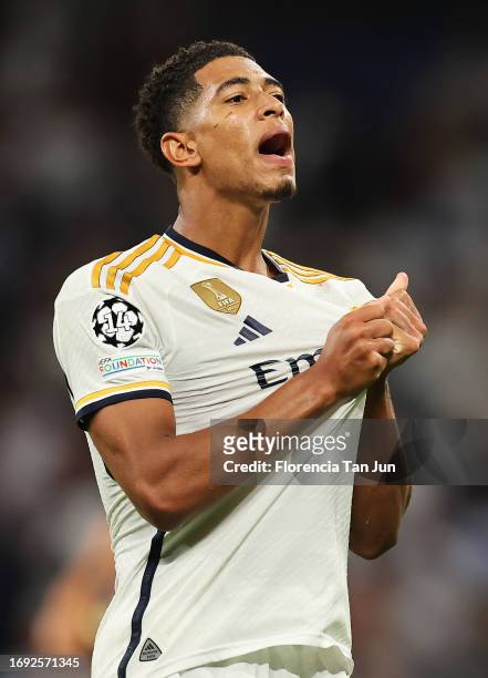 Jude Bellingham of Real Madrid celebrates after scoring their sides first goal during the UEFA Champions League match between Real Madrid CF and 1....