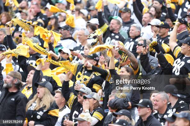 Pittsburgh Steelers fans wave terrible towels against the New York Jets during a game at Acrisure Stadium on October 2, 2022 in Pittsburgh,...