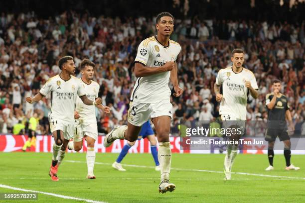 Jude Bellingham of Real Madrid celebrates after scoring their sides first goal during the UEFA Champions League match between Real Madrid CF and 1....