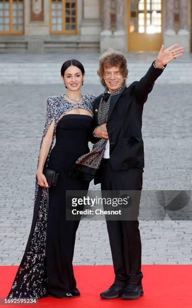 British singer Mick Jagger and his partner US choreographer Melanie Hamrick arrive to attend a state banquet with French President, Emmanuel Macron...