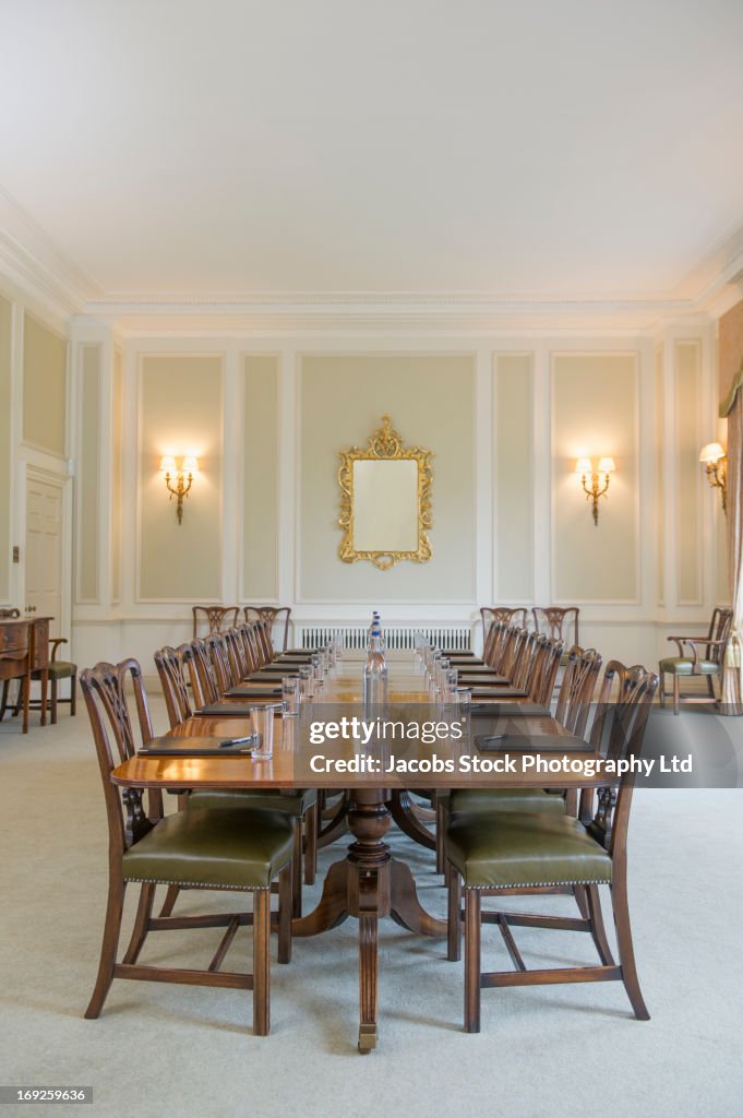 Table set in ornate meeting room