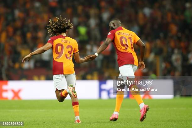 Sacha Boey and Tanguy Ndombele of Galatasaray interact during the UEFA Champions League match between Galatasaray A.S. And F.C. Copenhagen at Ali...