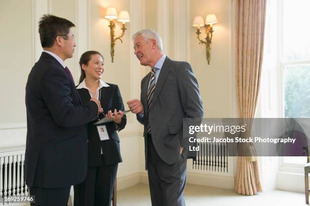 business people talking in meeting - ambassadeur stockfoto's en -beelden