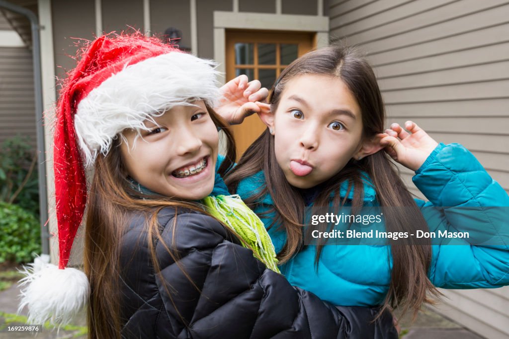 Mixed race girls making faces