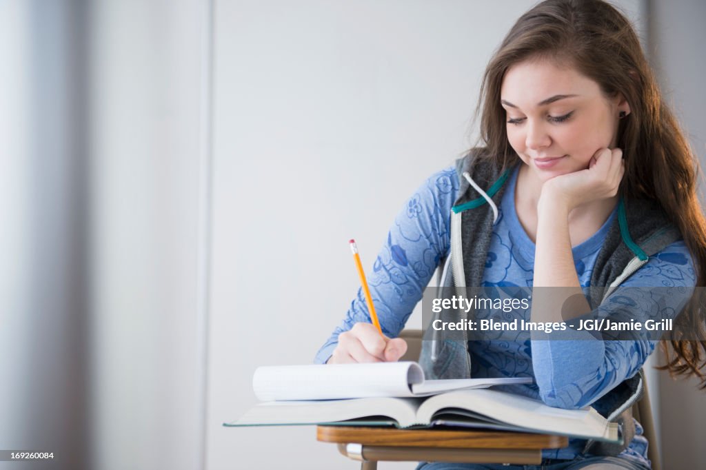 Hispanic girl studying at desk