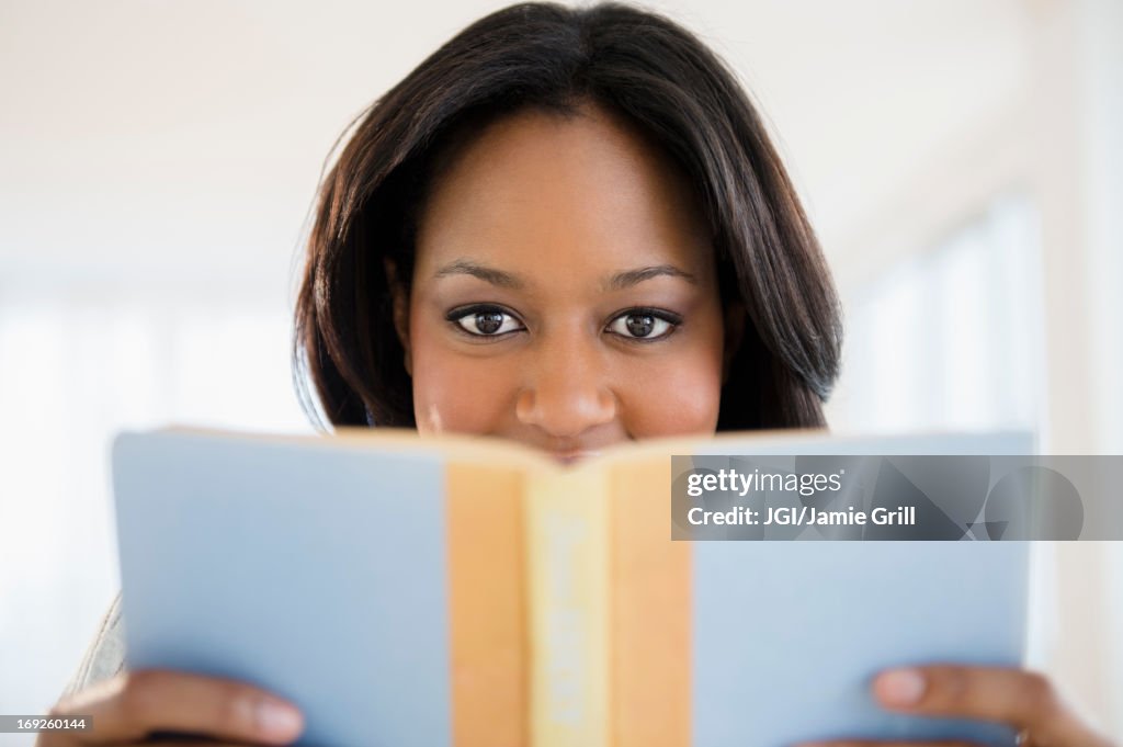 African American woman reading book