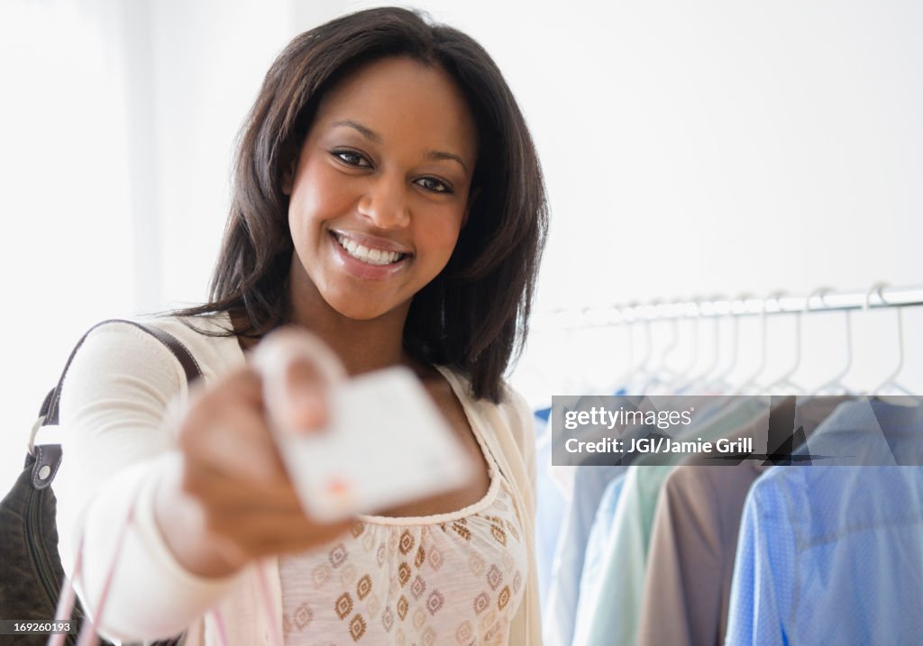 African American woman paying with credit card