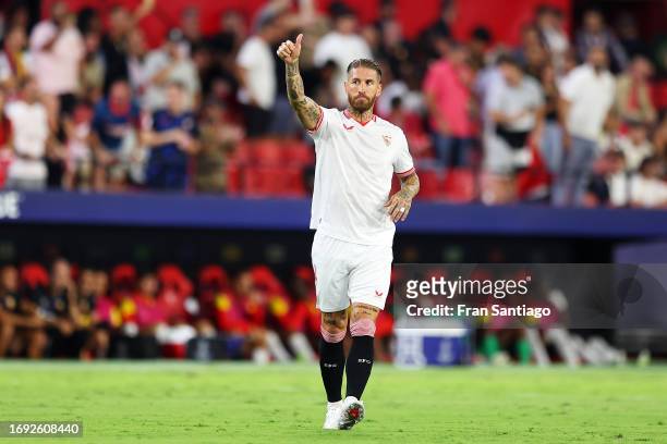 Sergio Ramos of Sevilla celebrates after teammate Lucas Ocampos scores the team's first goal during the UEFA Champions League match between Sevilla...
