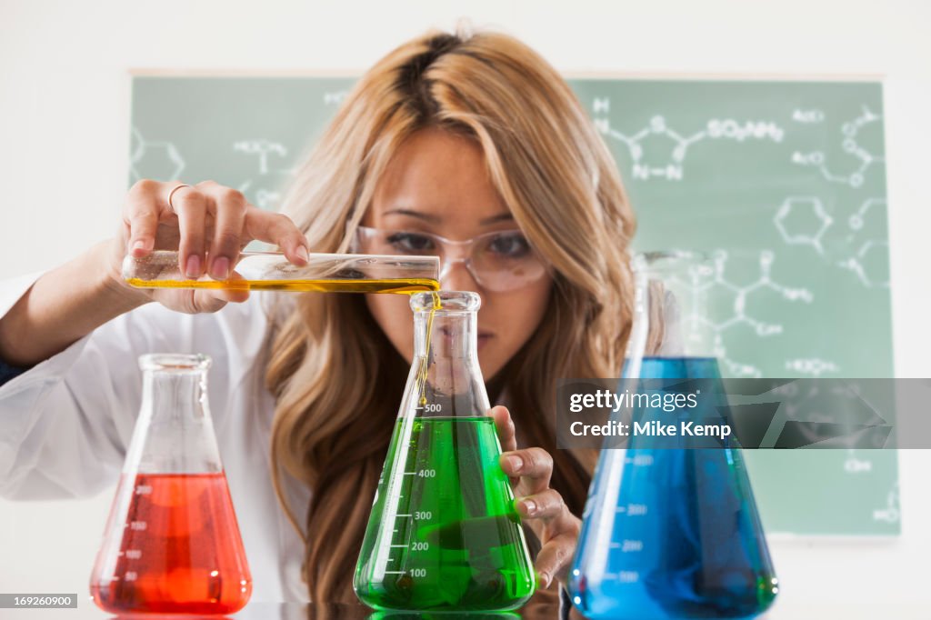 Mixed race student working in chemistry lab