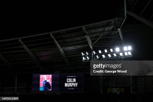 Picture of Colin Murphy, former assistant manager and director of development at Hull City, is displayed on the LED board for a minute of applause...
