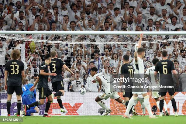 Jude Bellingham of Real Madrid CF scores their opening goal during the UEFA Champions League match between Real Madrid CF and Union Berlin at Estadio...