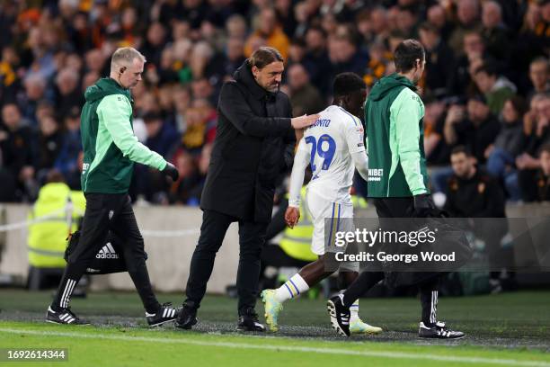 Daniel Farke, Manager of Leeds United, interacts with Wilfried Gnonto of Leeds United as he leaves the pitch following an injury during the Sky Bet...