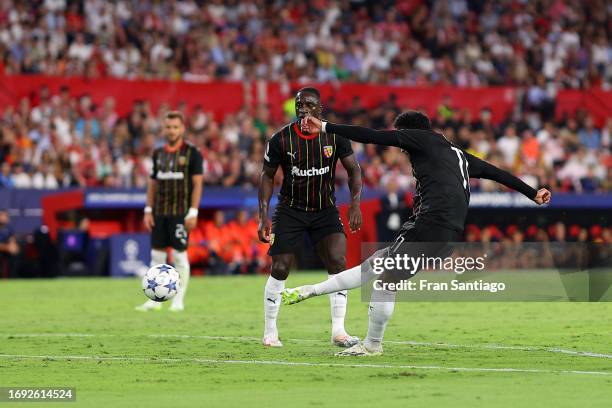 Angelo Fulgini of RC Lens scores the team's first goal during the UEFA Champions League match between Sevilla FC and RC Lens at Estadio Ramon Sanchez...
