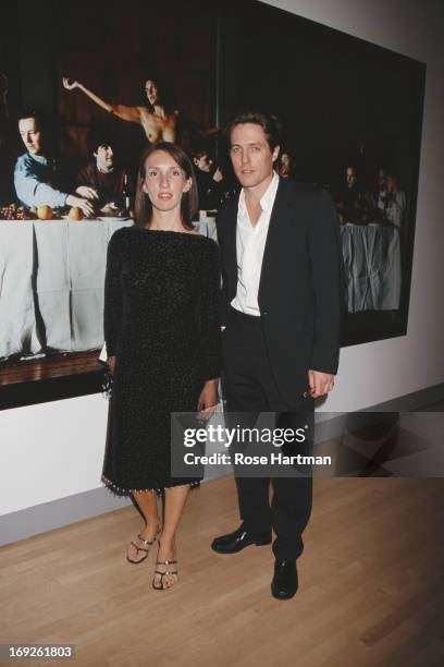 Artist Sam Taylor-Wood and actor Hugh Grant in front of Taylor-Wood's 'Wrecked' at the Sensation Benefit and Exhibition Preview at the Brooklyn...