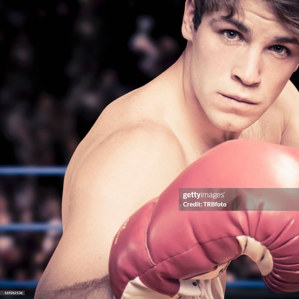 Caucasian boxer with fists raised