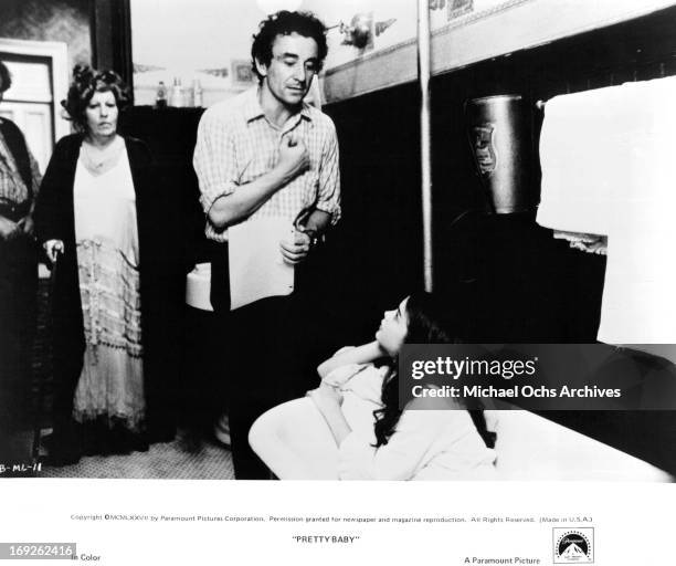 Frances Faye watches as director Louis Malle coaches Brooke Shields on set of the film 'Pretty Baby', 1978.