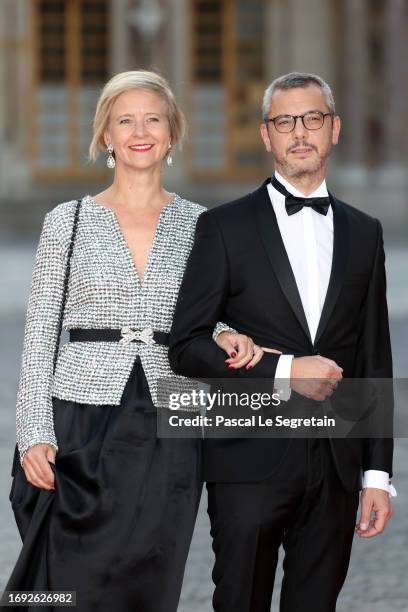 Alexis Kohler and his wife Sylvie Schirm arrive at the Palace of Versailles ahead of the State Dinner held in honor of King Charles III and Queen...