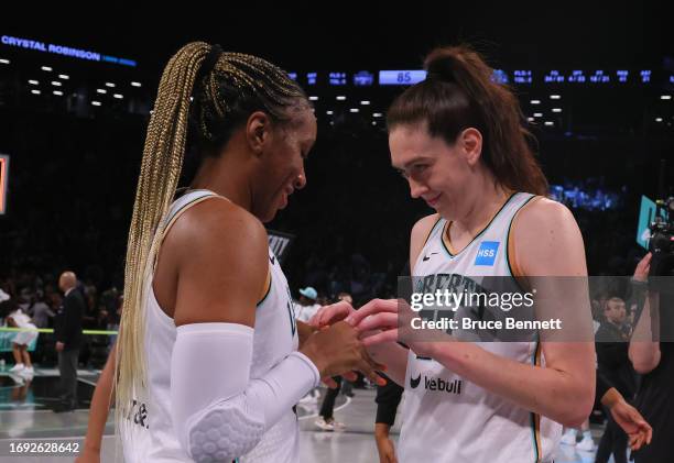 Kayla Thornton and Breanna Stewart of the New York Liberty celebrate their win against the Washington Mystics during Game Two of Round One of the...