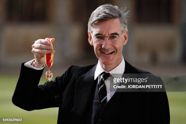 Jacob Rees-Mogg, Britain's former business secretary and MP for North East Somerset, poses after being made a Knight Commander of the British Empire...