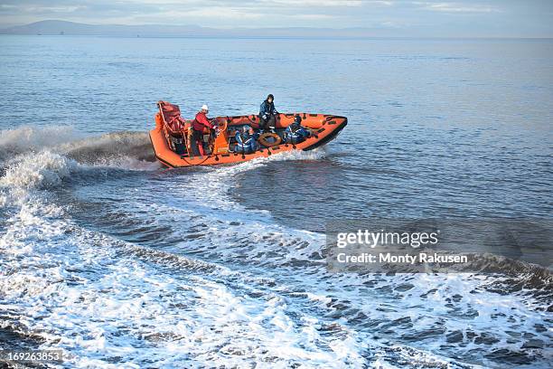 rescue boat training at nautical training facility - red boot stockfoto's en -beelden