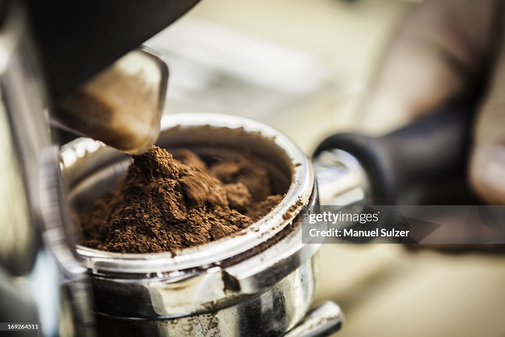 Close up of espresso grounds in machine