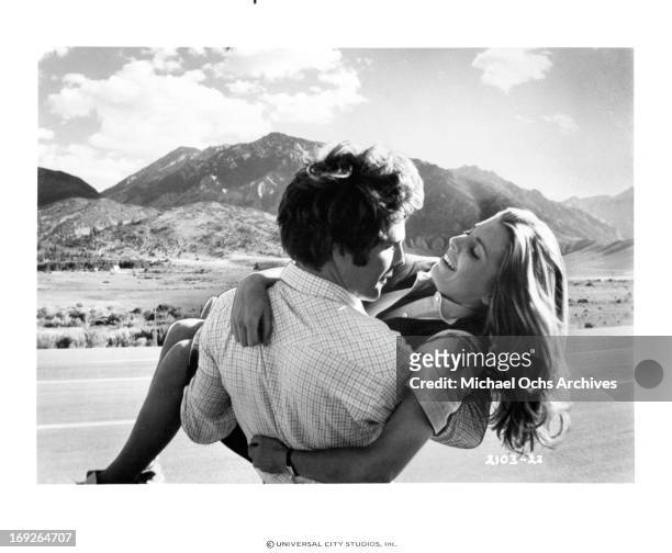 Timothy Bottoms holds Marilyn Hassett in a scene from the film 'The Other Side Of The Mountain: Part II', 1978.